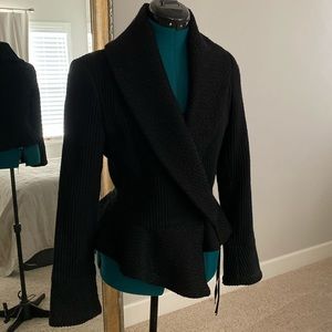 Poleci black wool peplum jacket fully lined.